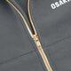 Women’s full-zip sweater with gold zipper and OSAKA logo on chest