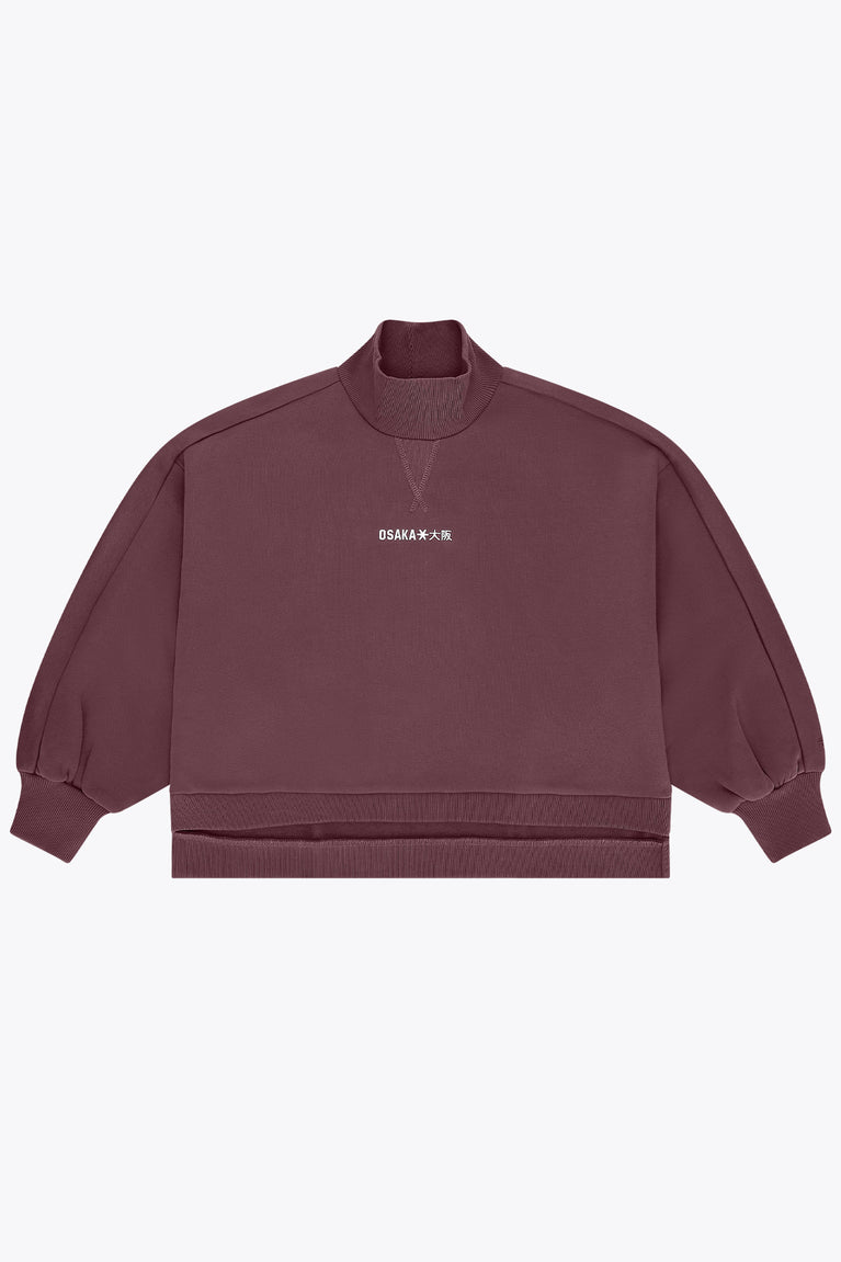 Women’s mockneck sweater in dark plum with small chest logo and relaxed sleeves
