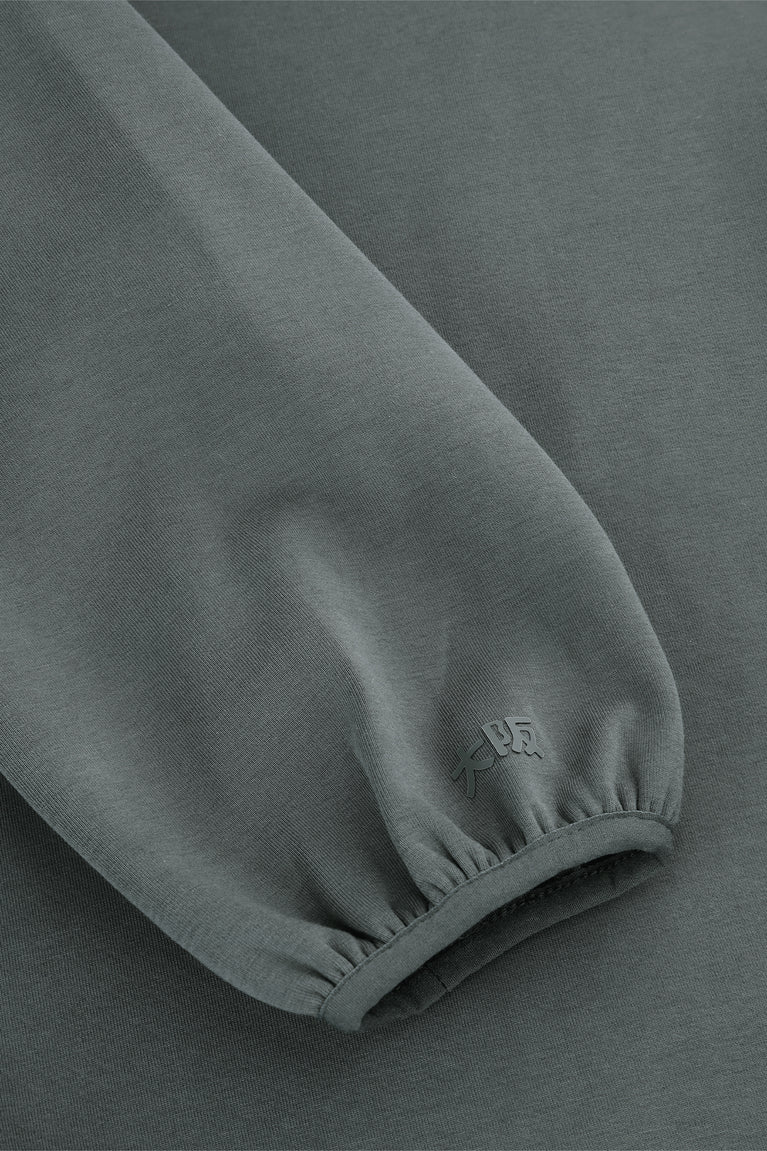 Dark grey melange unisex hoodie sleeve cuff with small embroidered emblem
