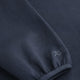 Navy knit sweater sleeve cuff with ribbed hem and seam detail