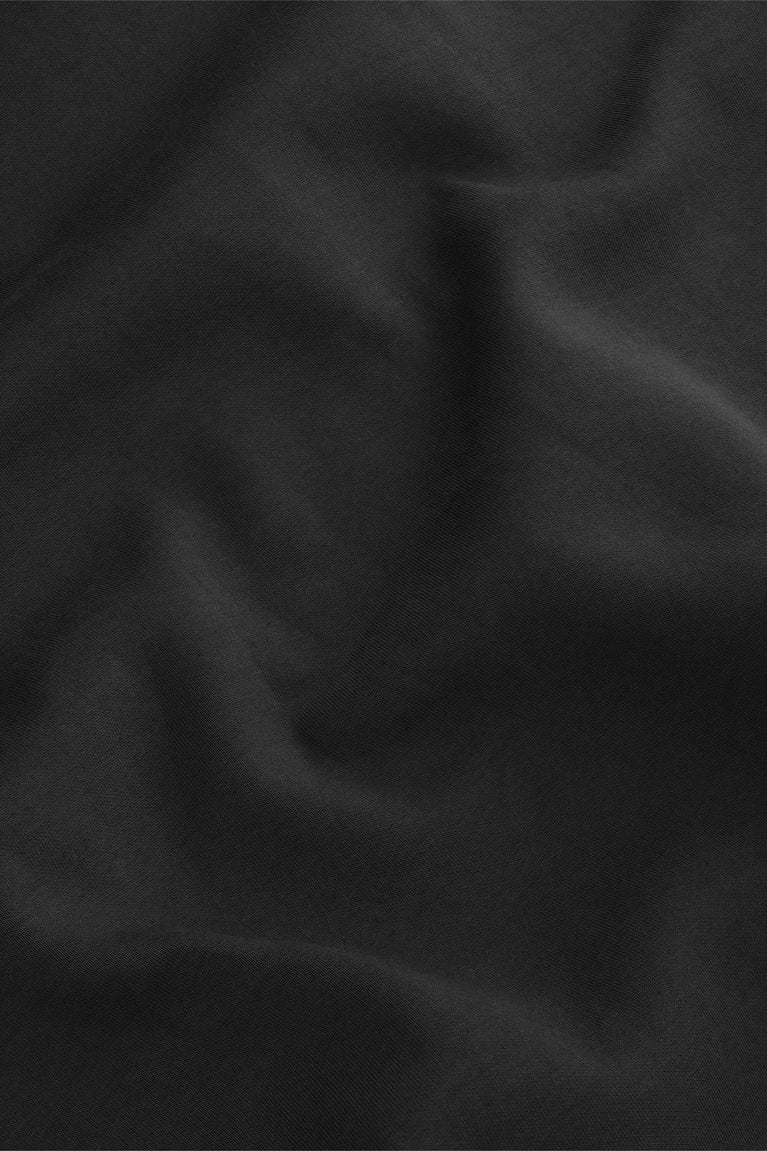 Black neo knit sweater fabric close-up