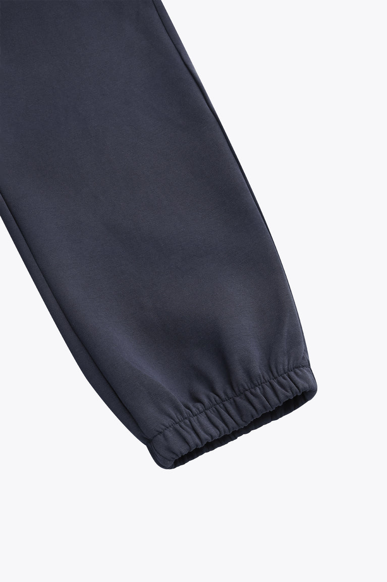 Navy sweatpants leg with elastic ankle cuff