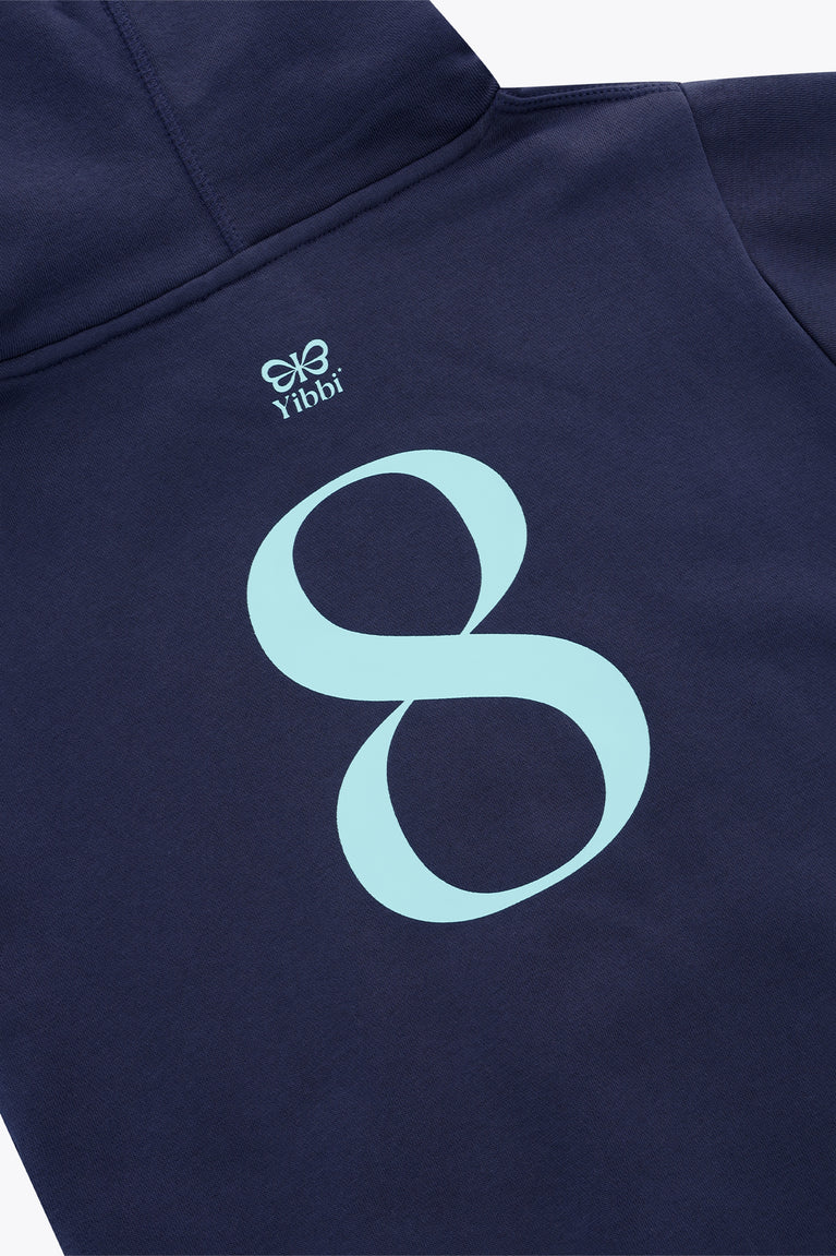 Kids deep sea navy hoodie close-up: mint Yibbi logo graphic and hood seam stitching.