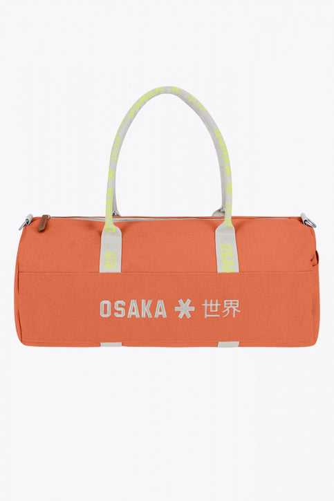 Osaka cotton duffel in peach with logo. Front view
