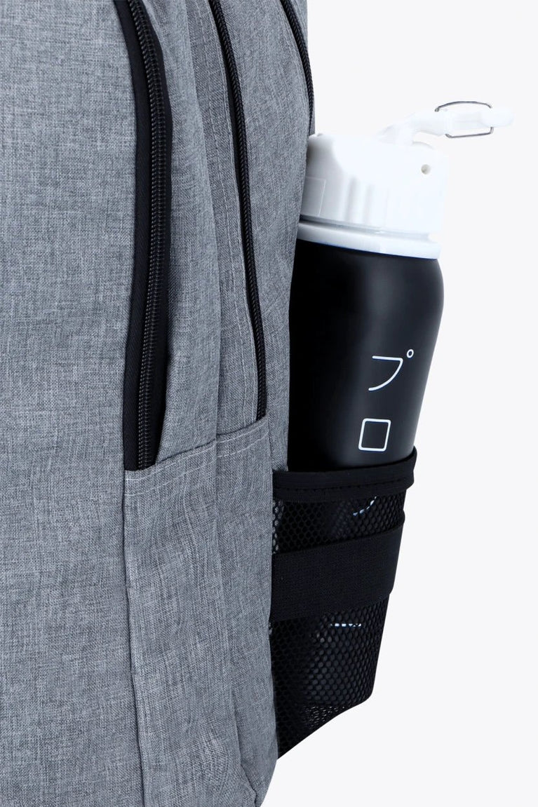 Osaka sports backpack in light grey with logo in blue. Water bottle holder view