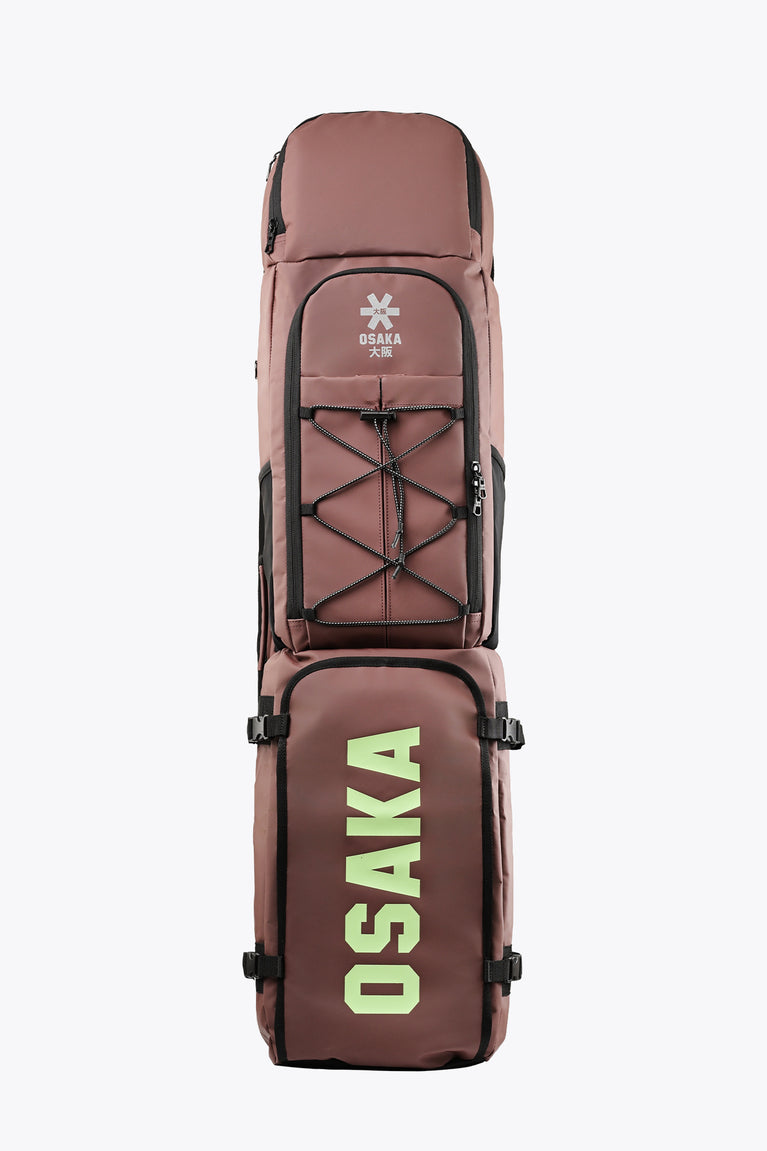 Large Osaka stick bag in peppercorn brown with bold green Osaka logo on front.