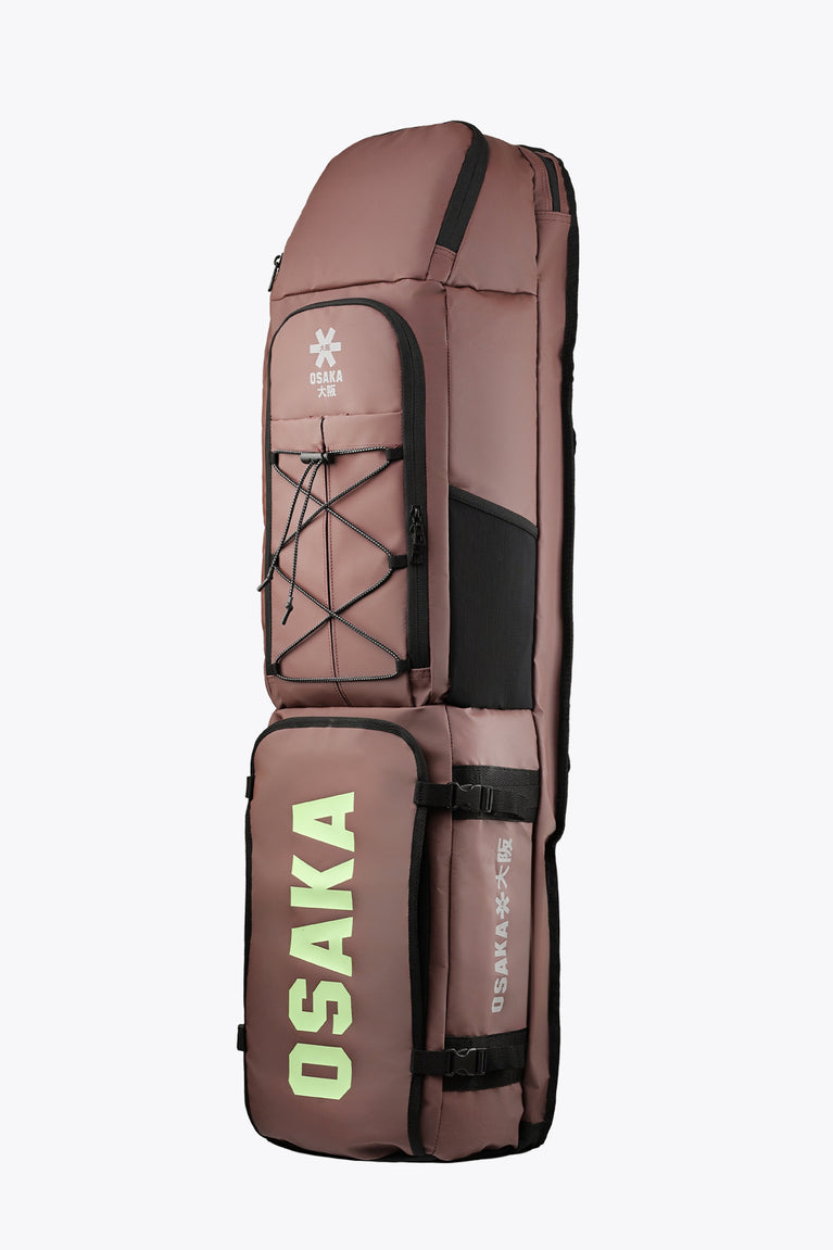 Large Osaka stick bag in peppercorn brown with side straps and compartment panels.