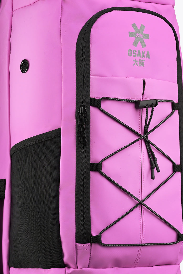 Close-up rose bud stickbag front pocket with star logo, laced net panel, black trim