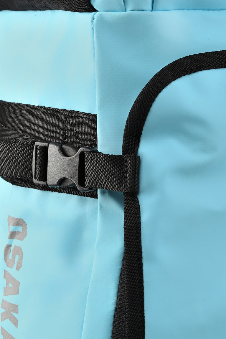 Detail of black waist strap and buckle on light blue Osaka large stickbag