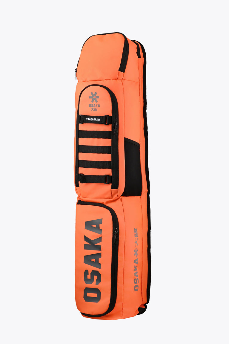 Medium orange stickbag side view with Osaka logo panel and black strap ladder.