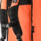 Close-up of black shoulder straps on orange stickbag, with padded webbing.