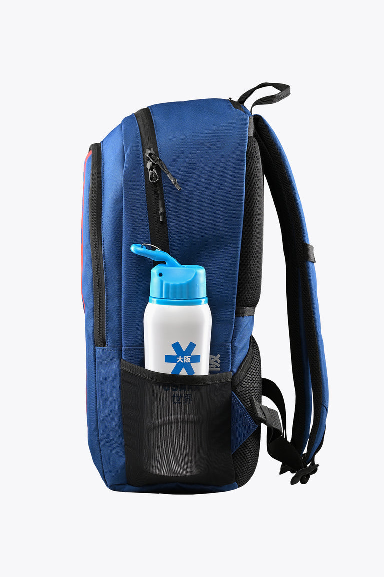 Osaka sports backpack, blue with black side pocket holding a water bottle