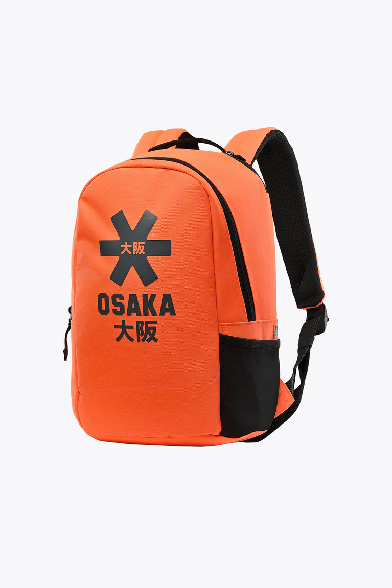 Kids sports backpack, orange with black trim and front OSAKA logo, side view