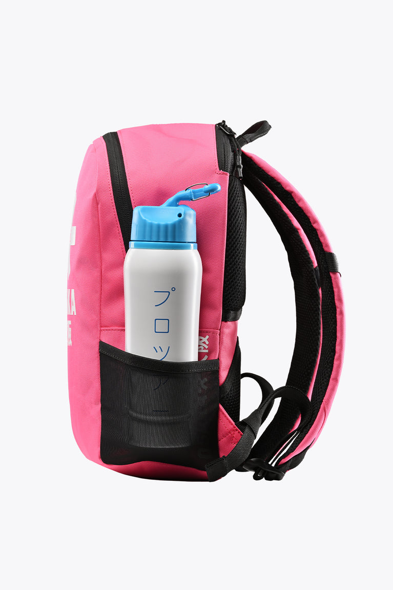Kids hot pink backpack with front pocket holding a blue water bottle
