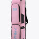 Pastel pink hockey stick bag with black side panels and two compartments