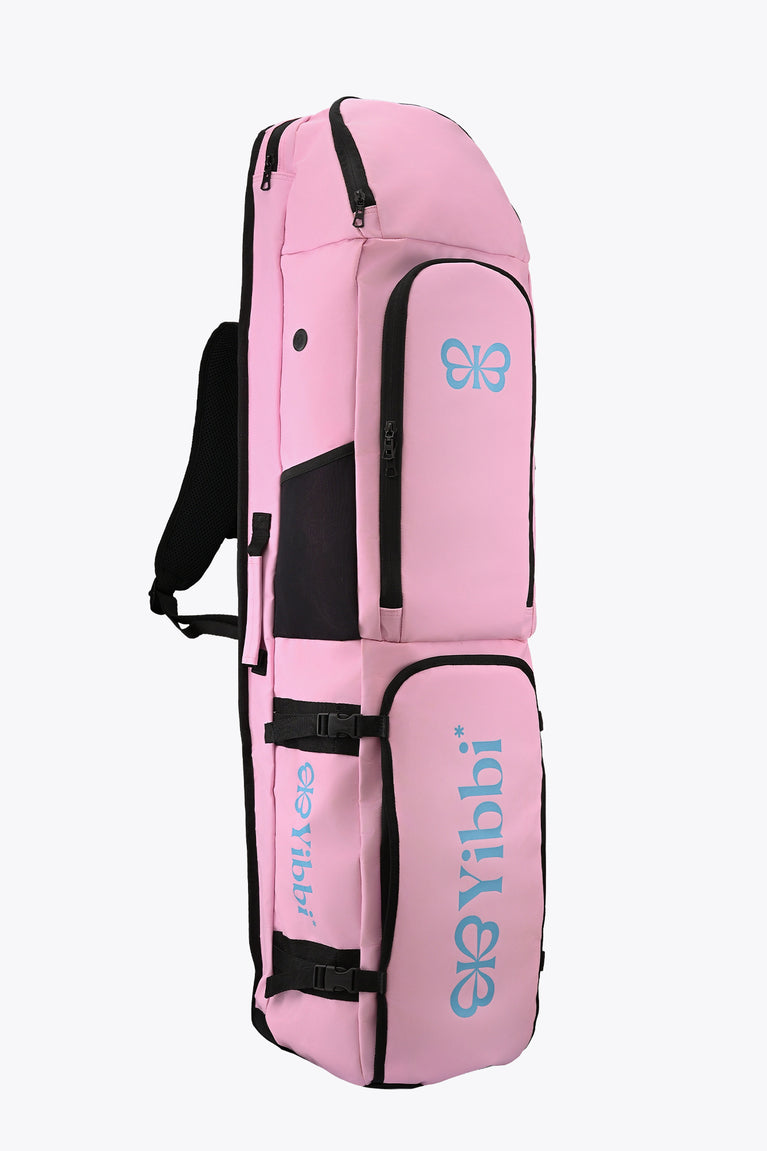 Pastel pink hockey stick bag with carrying handle, black straps, and logo