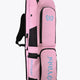 Pastel pink hockey stick bag with carrying handle, black straps, and logo