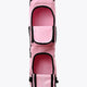 Pastel pink hockey stick bag with two oval openings and black support straps
