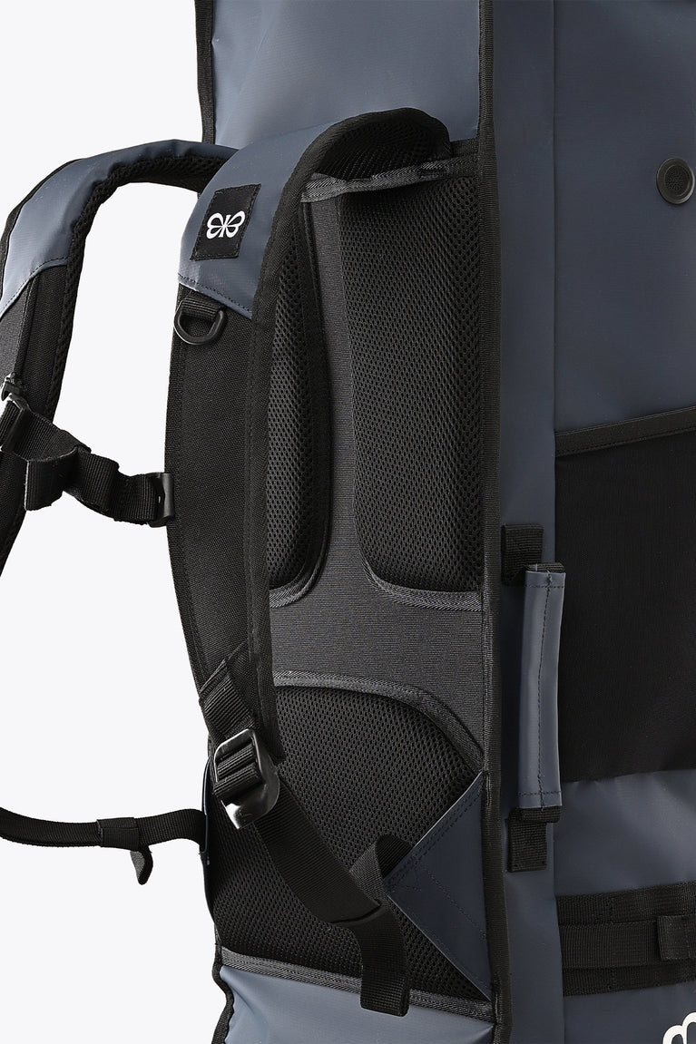 Hockey stick bag close-up: dark navy mesh back panel with adjustable strap