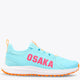Light blue athletic sneaker with orange lace accents and cushioned white sole