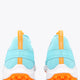 Light blue sneaker with orange heel pull tab and padded collar