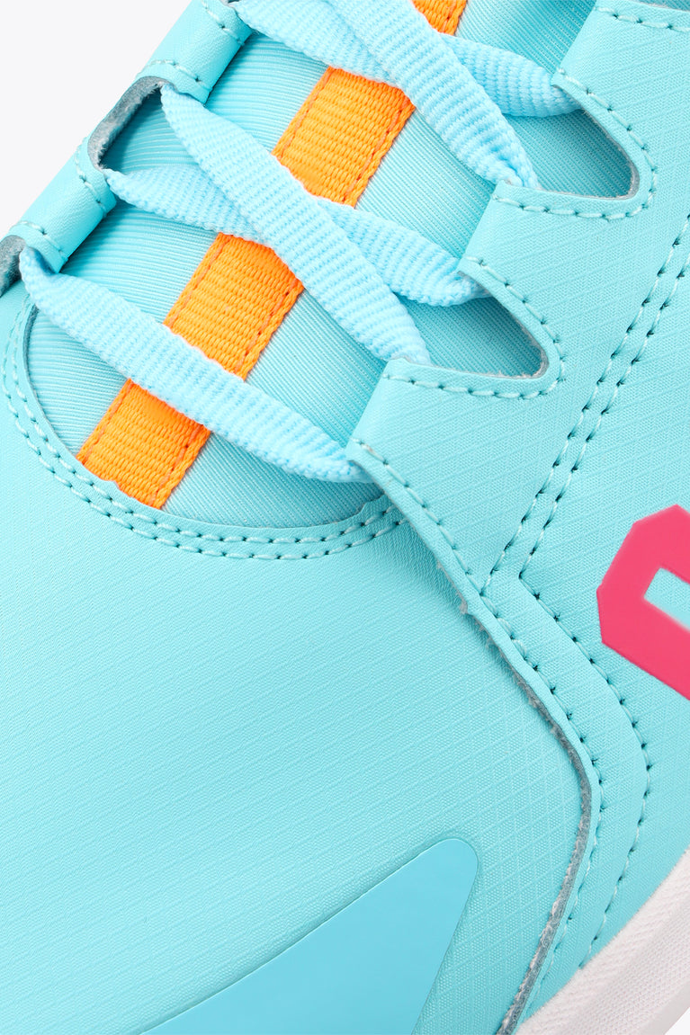Light blue sneaker side with orange square eyelets, orange laces, and pink logo
