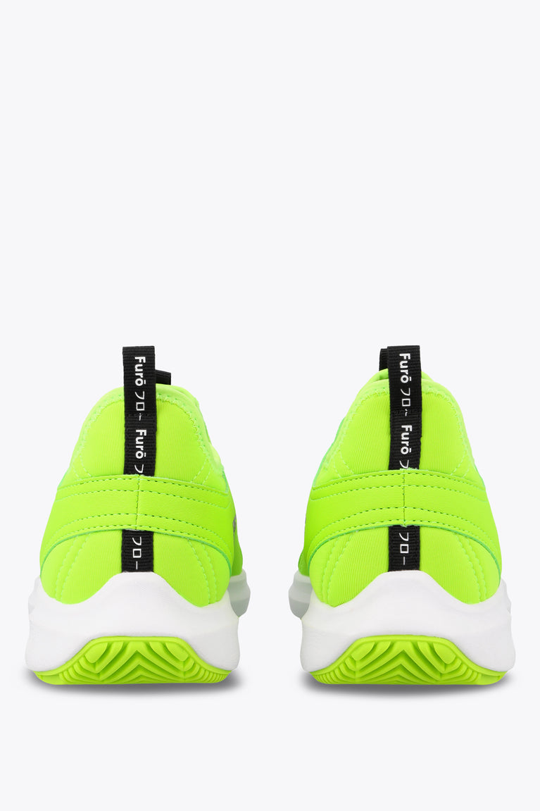 Lime green lace-up sneaker with black heel pull tab reading