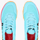 Pair of light blue sneakers with red inner lining and orange trim