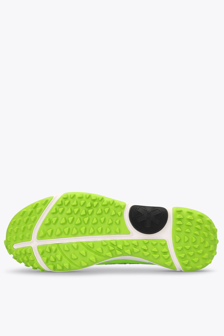 Neon green and white rubber outsole with textured tread and side grip