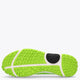 Neon green and white rubber outsole with textured tread and side grip