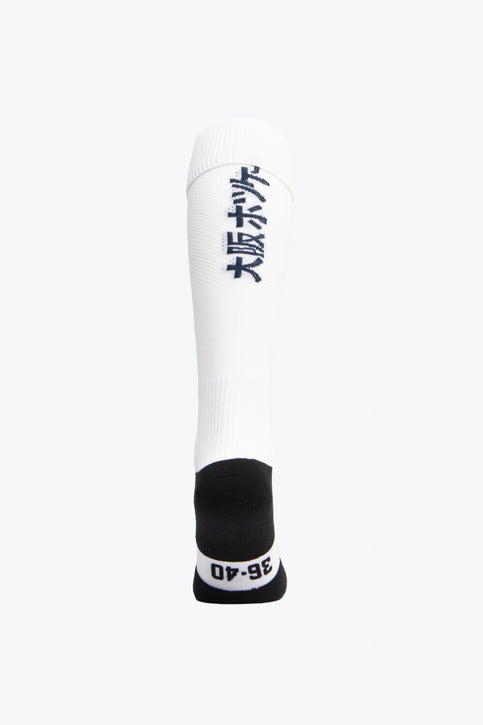 Egara Field Hockey Socks | White Egara Socks in white with Osaka logo in green. Front view