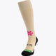 Osaka Field Hockey Socks in sand with Osaka logo in green. Front view
