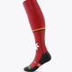 Red field hockey socks with yellow band, white logo marks, black heel/toe and ribbing