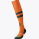 Orange field hockey socks with black mid-calf stripe, black toe and heel, crest detail