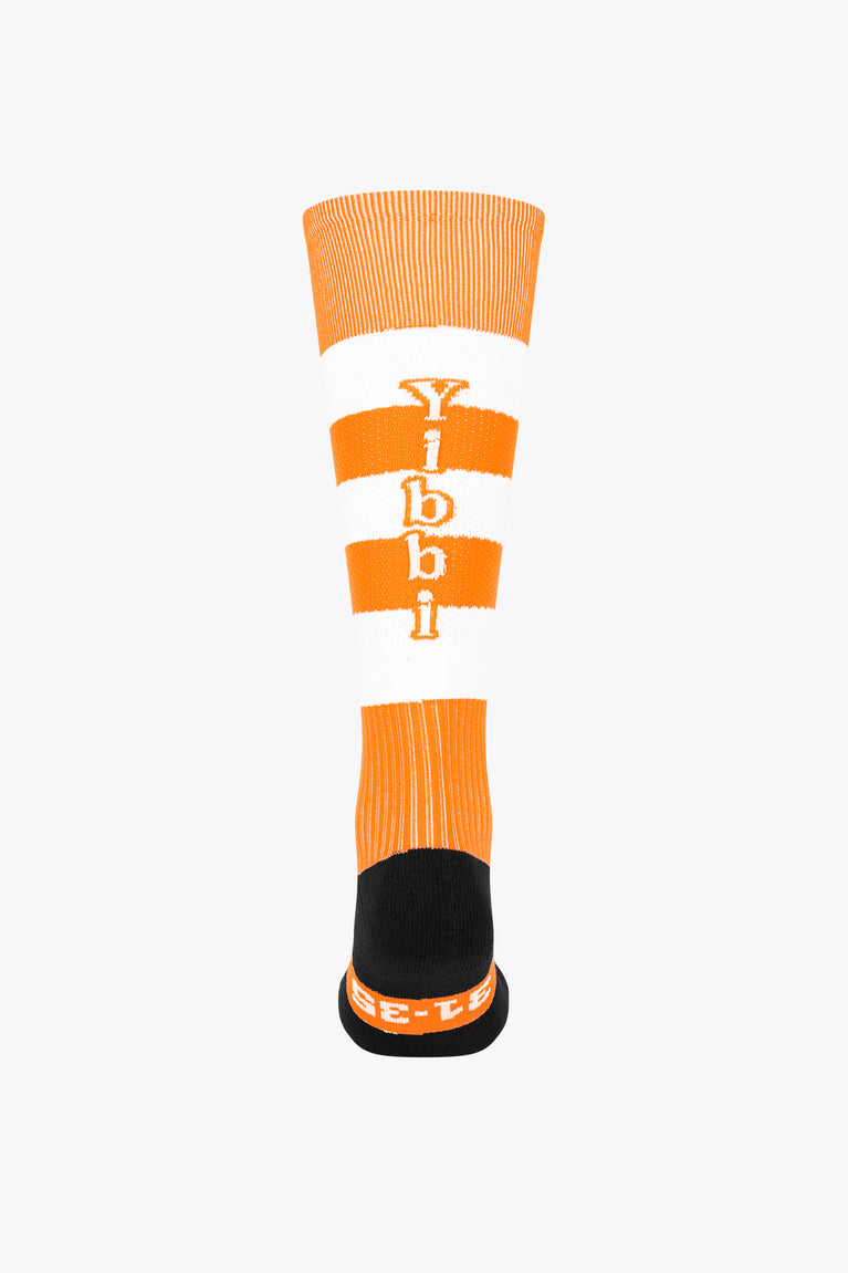 Orange field hockey crew socks with white bands, orange logo, and black foot base