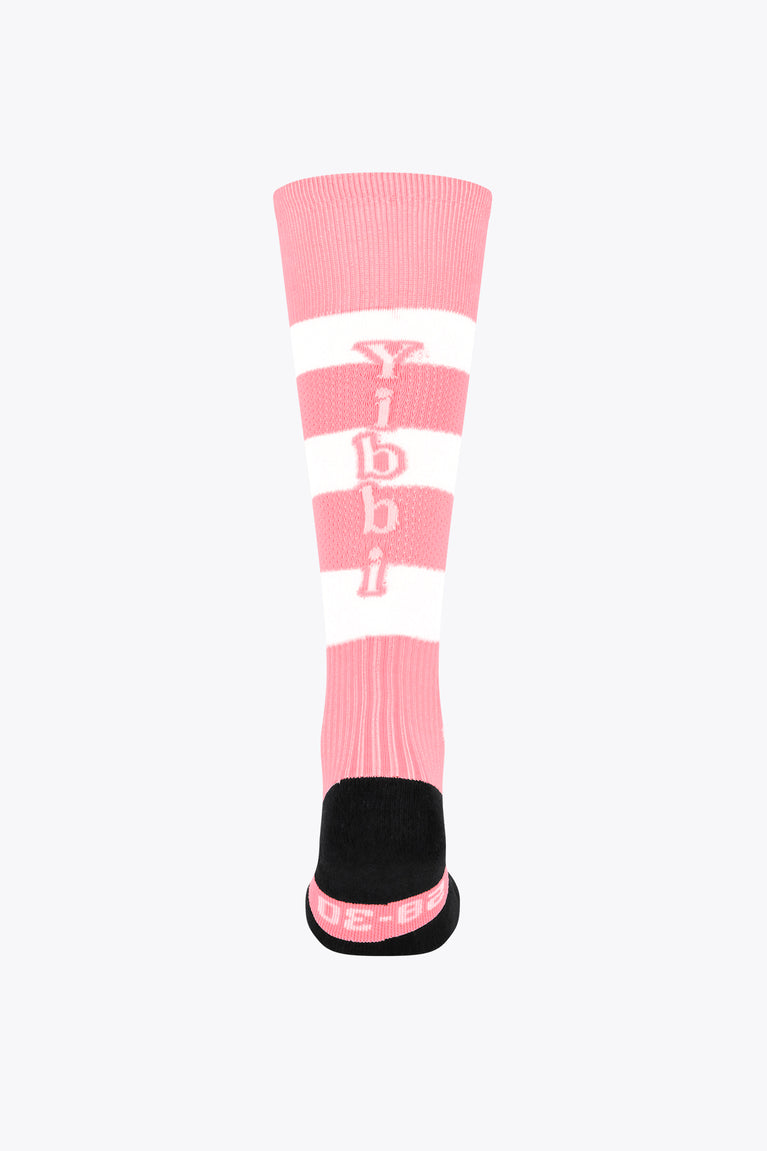 Pastel pink field hockey socks with white bands and Yibbi logo at cuff