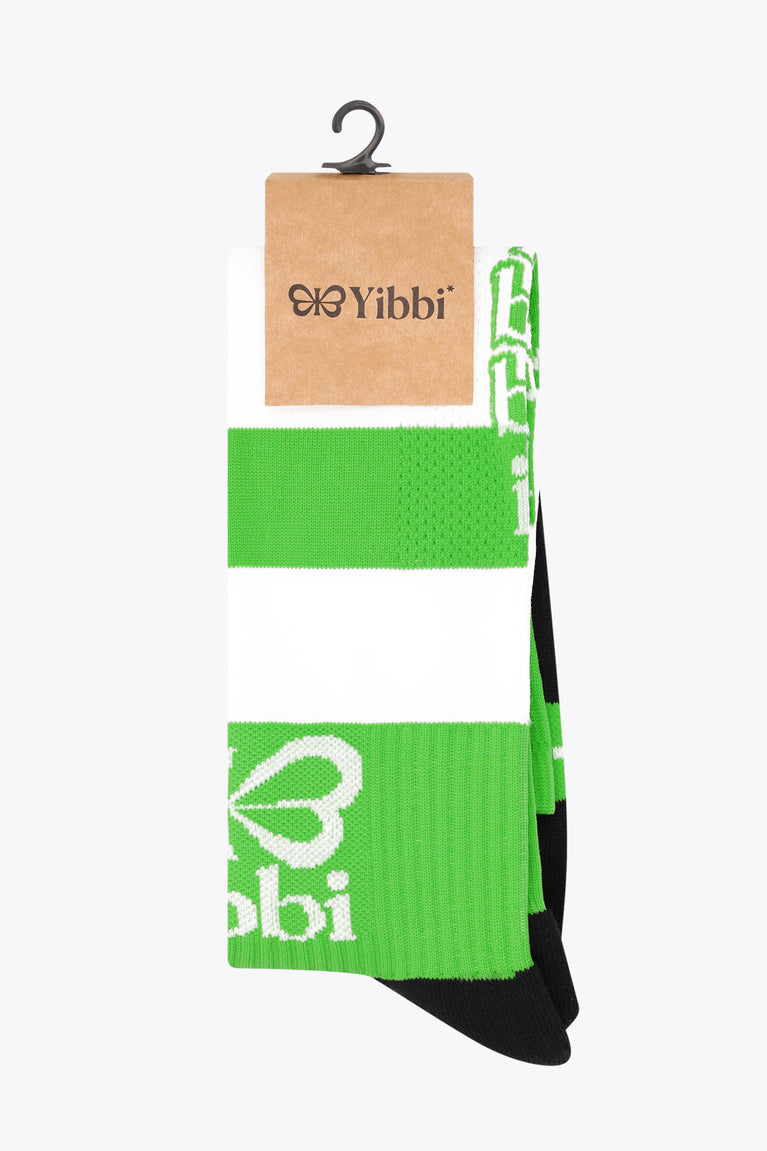 Fluo green field hockey socks on hanger with white stripes and black toe, Yibbi branding