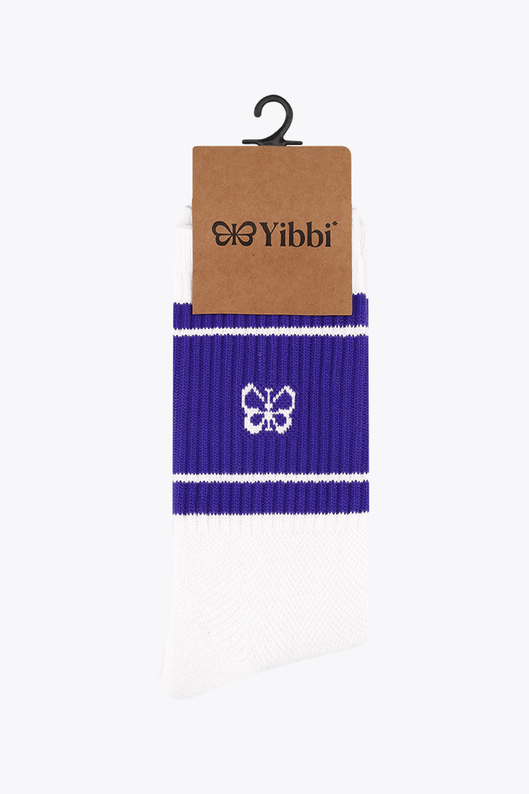 White sport socks with purple cuff band and small flower logo