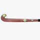 Brown field hockey stick with green star decals and black handle end.