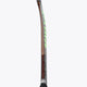 Field hockey stick shaft side view with lime and light graphics and black grip.