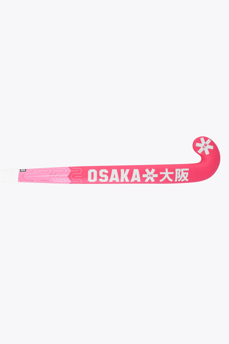 Hot pink field hockey stick with long straight shaft and Osaka text