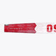 Osaka field hockey stick shaft close-up, hot pink and white geometric pattern.
