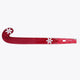 Hot pink field hockey stick with curved blade and printed markings along the shaft