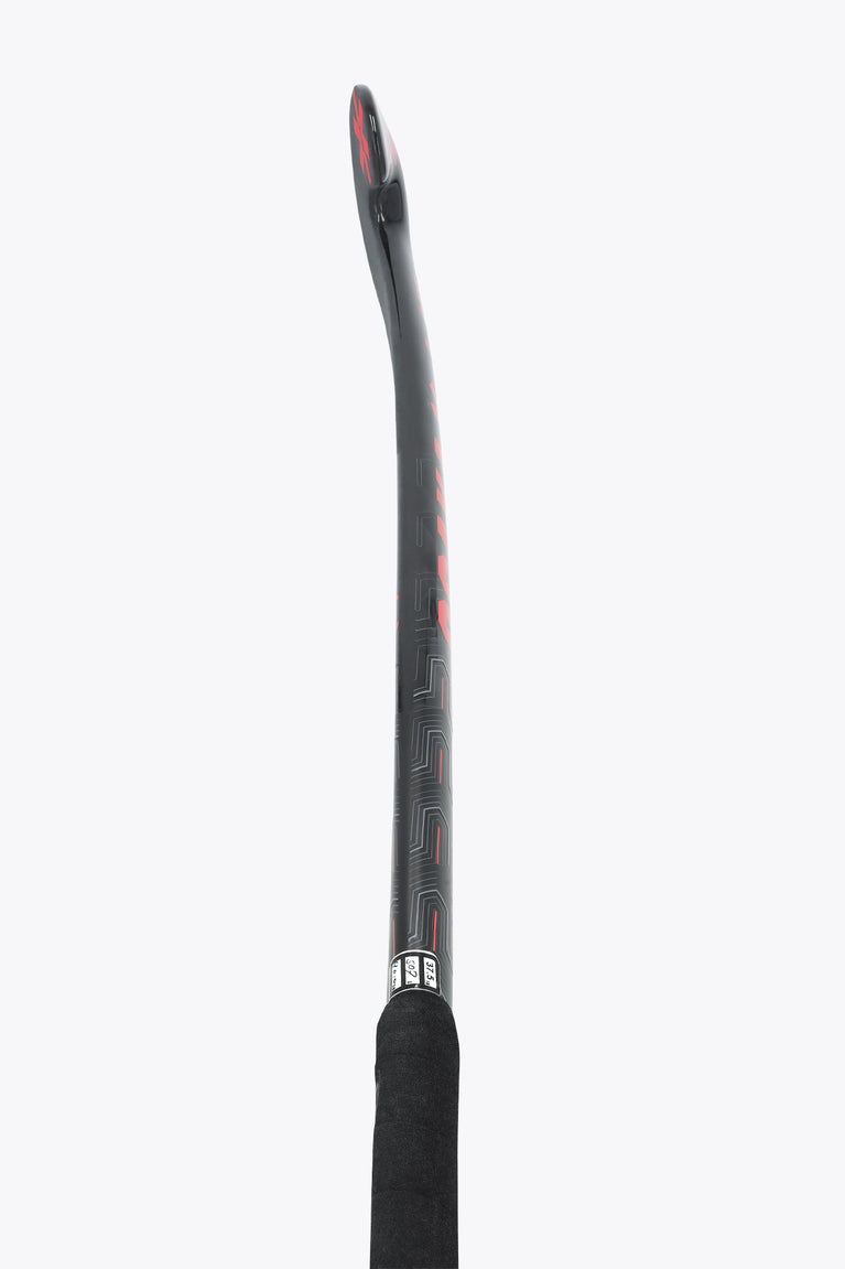 Black field hockey stick shaft with patterned grip at the top