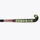 Field hockey stick blade with OSAKA branding and green star accents, black grip end