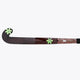 Field hockey stick blade side view, dark brown surface with green star details