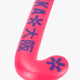 Hot pink mid-bow field hockey stick blade with OSAKA-style lettering and symbols