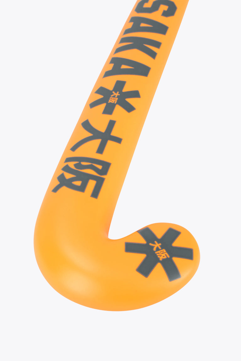 Orange field hockey stick head with black geometric markings and Osaka text
