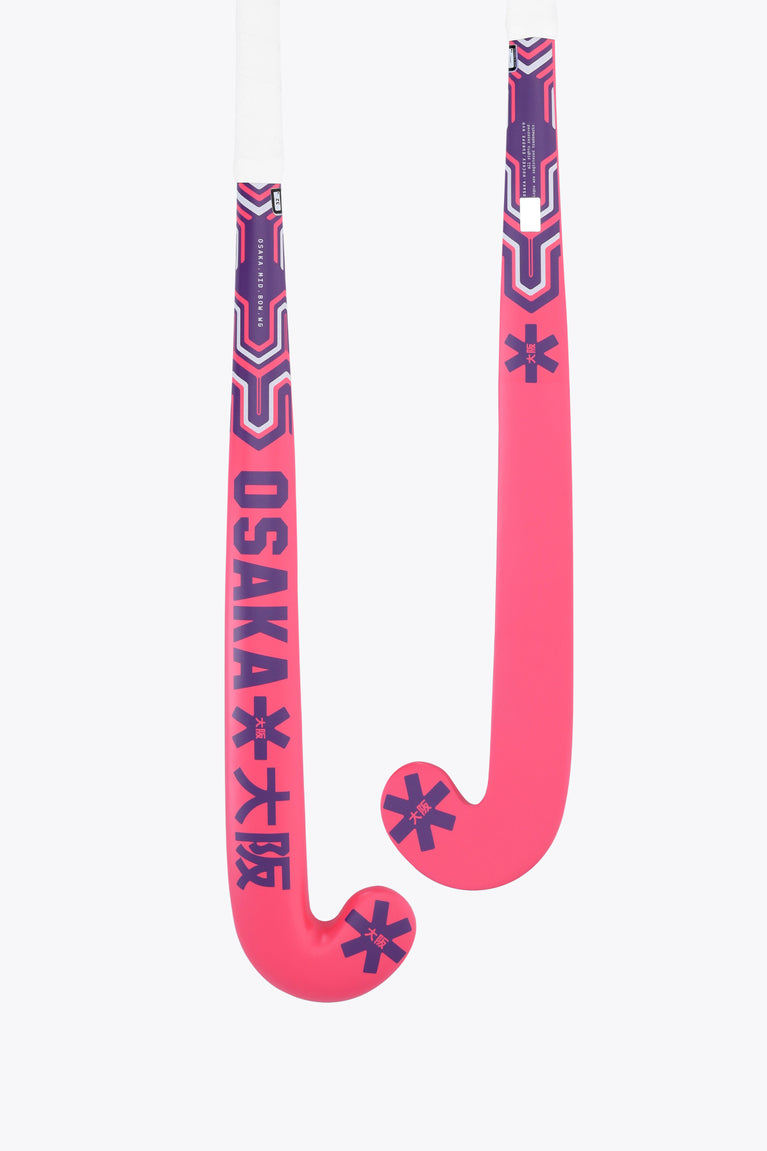 Hot pink Osaka field hockey stick, mid bow, dark graphic accents on head
