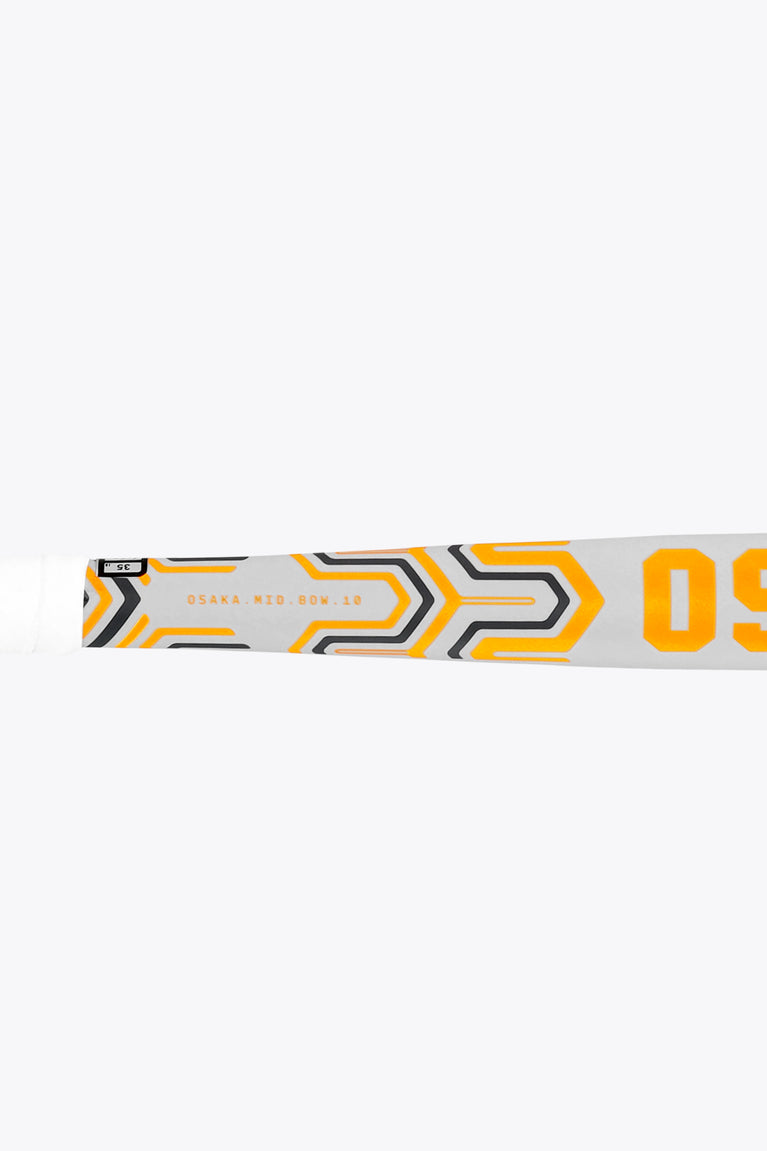 Osaka mid-bow field hockey stick, close-up of orange graphic band and text